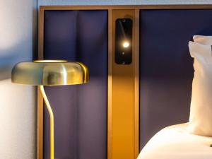 Postel nebo postele na pokoji v ubytování Mercure Toulouse Aeroport Blagnac