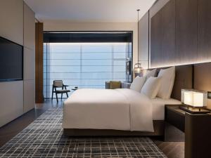 Voodi või voodid majutusasutuse Pullman Quanzhou Shuitou toas