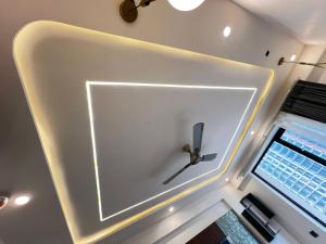 a large white wall with a scissors on it at Leisure homes in Lucknow