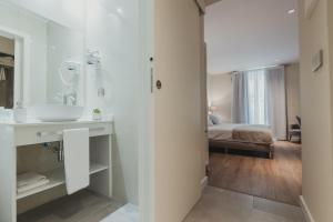 Posteľ alebo postele v izbe v ubytovaní Olivae Hostal Boutique