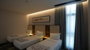 Letto o letti in una camera di Ajm Mina Hotel