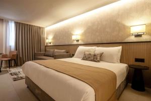 Letto o letti in una camera di Caesar Premier Jerusalem Hotel