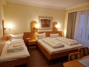 Postel nebo postele na pokoji v ubytování Hotel Wikinger Hof