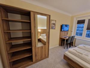 Postel nebo postele na pokoji v ubytování Hotel Wikinger Hof