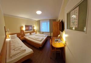 Postel nebo postele na pokoji v ubytování Hotel Wikinger Hof