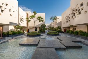 a view of the courtyard of a building at The Biltmore Hotel Villas Dubai in Dubai