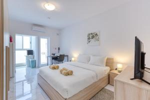 Ένα ή περισσότερα κρεβάτια σε δωμάτιο στο New Studio in Msida
