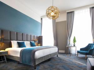 Voodi või voodid majutusasutuse Iveagh Garden Hotel toas