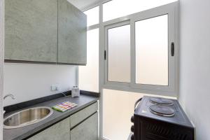 Η κουζίνα ή μικρή κουζίνα στο New Studio in Msida