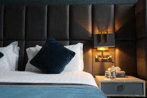 Voodi või voodid majutusasutuse Iveagh Garden Hotel toas