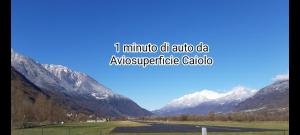 a view of a mountain range with the words iinia old audio data ayyss at Villa Luisa Appartamenti Vacanze in Caiolo