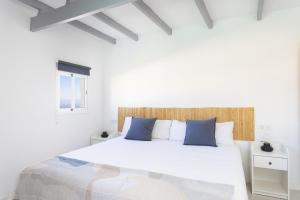 Ένα ή περισσότερα κρεβάτια σε δωμάτιο στο Oasis Tenerife Rentals con Piscina climatizada, Cocina exterior y Barbacoa +72 φωτογραφίες