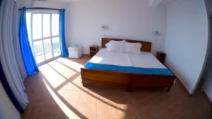 Letto o letti in una camera di Cacimba Sunset Lodge