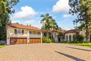 a large house with a brick driveway at @ Marbella Lane - Hidden Gem in Orange County in Orange