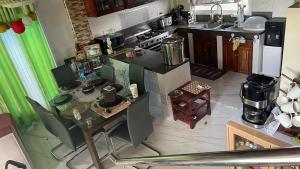 an overhead view of a small kitchen with a table at MJs Homestay, Overlooking, Free airport pickup & dropped off in Laguindingan