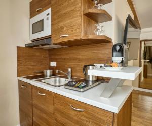 Kuchyň nebo kuchyňský kout v ubytování Hotel Kraft