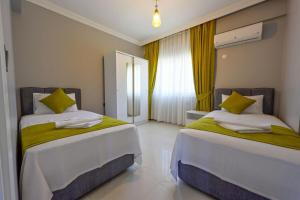 Postel nebo postele na pokoji v ubytování Spacious Villa for Large Families - Egeden 2 + 29 fotografií