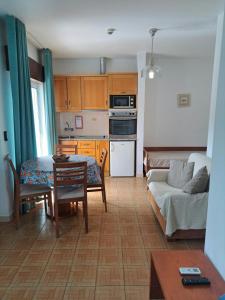 a living room with a couch and a table at Mira Parque in Albufeira