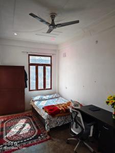 Postel nebo postele na pokoji v ubytování Rai Homestay
