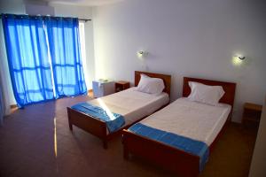 Letto o letti in una camera di Cacimba Sunset Lodge