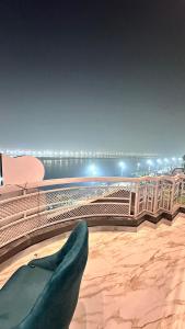 a view of a stage with a persons feet on the floor at Sapphire By the Ganges in Prayagraj