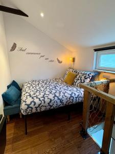 a bedroom with a bed and a bed and a window at Au Ch'ti Cosy in Roubaix +7 photos