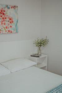 Postel nebo postele na pokoji v ubytování Hotel Dona Pina