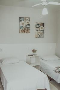 Postel nebo postele na pokoji v ubytování Hotel Dona Pina