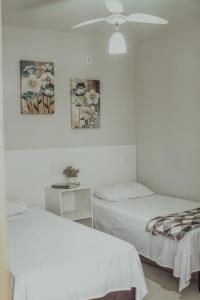Postel nebo postele na pokoji v ubytování Hotel Dona Pina