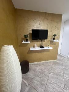 Μια τηλεόραση ή/και κέντρο ψυχαγωγίας στο Aurora apartment