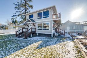 a large white house with snow on the ground at Ocean Views and Beach Access at Cottage on Birch Bay in Blaine