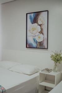 Postel nebo postele na pokoji v ubytování Hotel Dona Pina