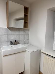 Kuchyň nebo kuchyňský kout v ubytování Sleep & Stay