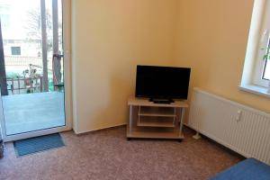 TV a/nebo společenská místnost v ubytování Ferienwohnung 8