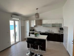 Kuchyň nebo kuchyňský kout v ubytování Beach Apartments