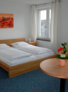 Кровать или кровати в номере Klein aber fein zentrale Ferienwohnung 30qm im Hotel zur Börse