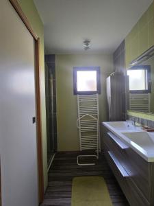 a bathroom with a sink and a mirror at la belle de volnay in Volnay
