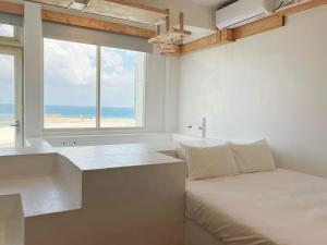 Letto o letti in una camera di White&Light B&B