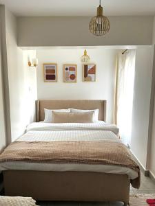 a bedroom with a large bed in a room at Coaral Bells Tsavo in Kiambu