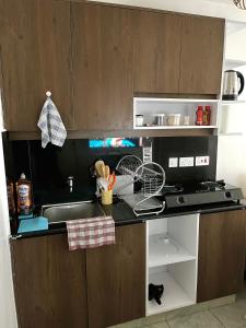 a kitchen with a sink and a counter top at Coaral Bells Tsavo in Kiambu