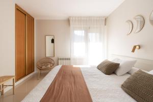 Cama o camas de una habitación en Hostal Lóbrega