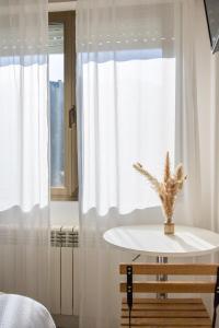 Cama o camas de una habitación en Hostal Lóbrega