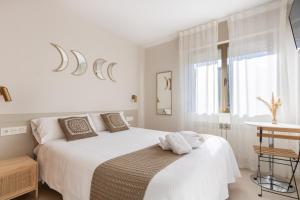 Cama o camas de una habitación en Hostal Lóbrega