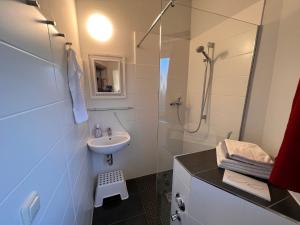 Koupelna v ubytování Ferienhaus Leuchtturm + 10 fotografií