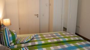 Postel nebo postele na pokoji v ubytování Ferienwohnung Gute Zeit - Apartment 2