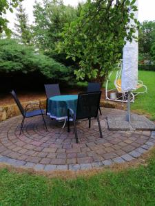 a table and chairs on a brick patio at Hasenecke in Bad Salzungen