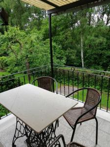 a white table and two chairs on a balcony at Hasenecke in Bad Salzungen