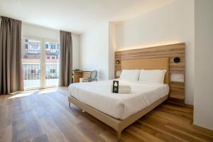 Postel nebo postele na pokoji v ubytování B&B HOTEL Sassari