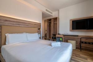 Postel nebo postele na pokoji v ubytování B&B HOTEL Sassari