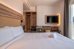 Postel nebo postele na pokoji v ubytování B&B HOTEL Sassari